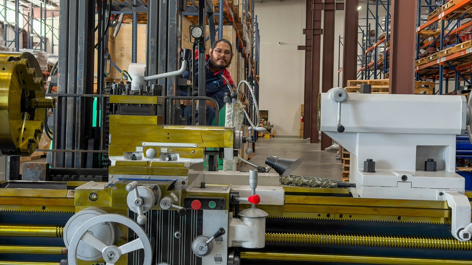 A Pinnacle-Flo machinist at the lathe on the Cypress shop floor